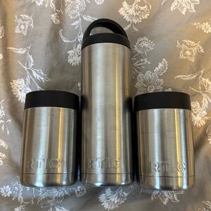 (2) RTIC Metal Koozies & (1) RTIC Water Bottle